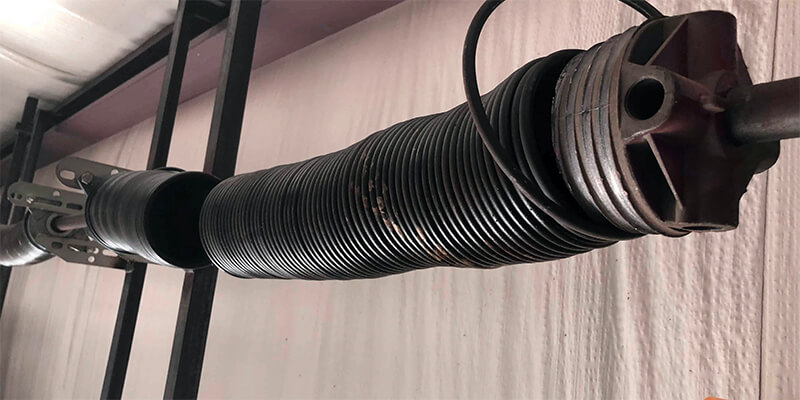 Garage Door Spring Adjustment - Supreme Garage Door Repair