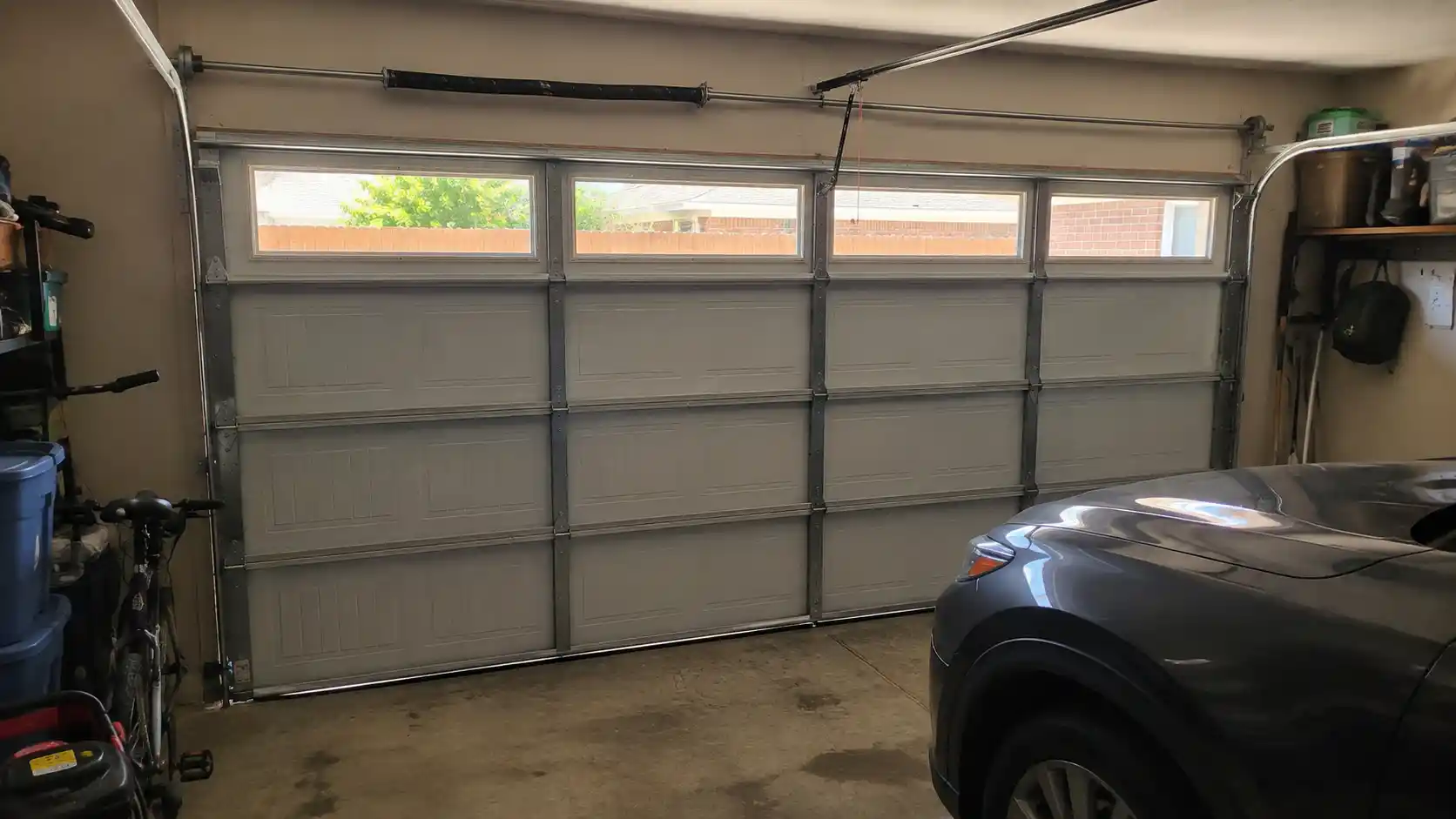 Insulated garage door with weather seals in a Dallas Texas residential garage