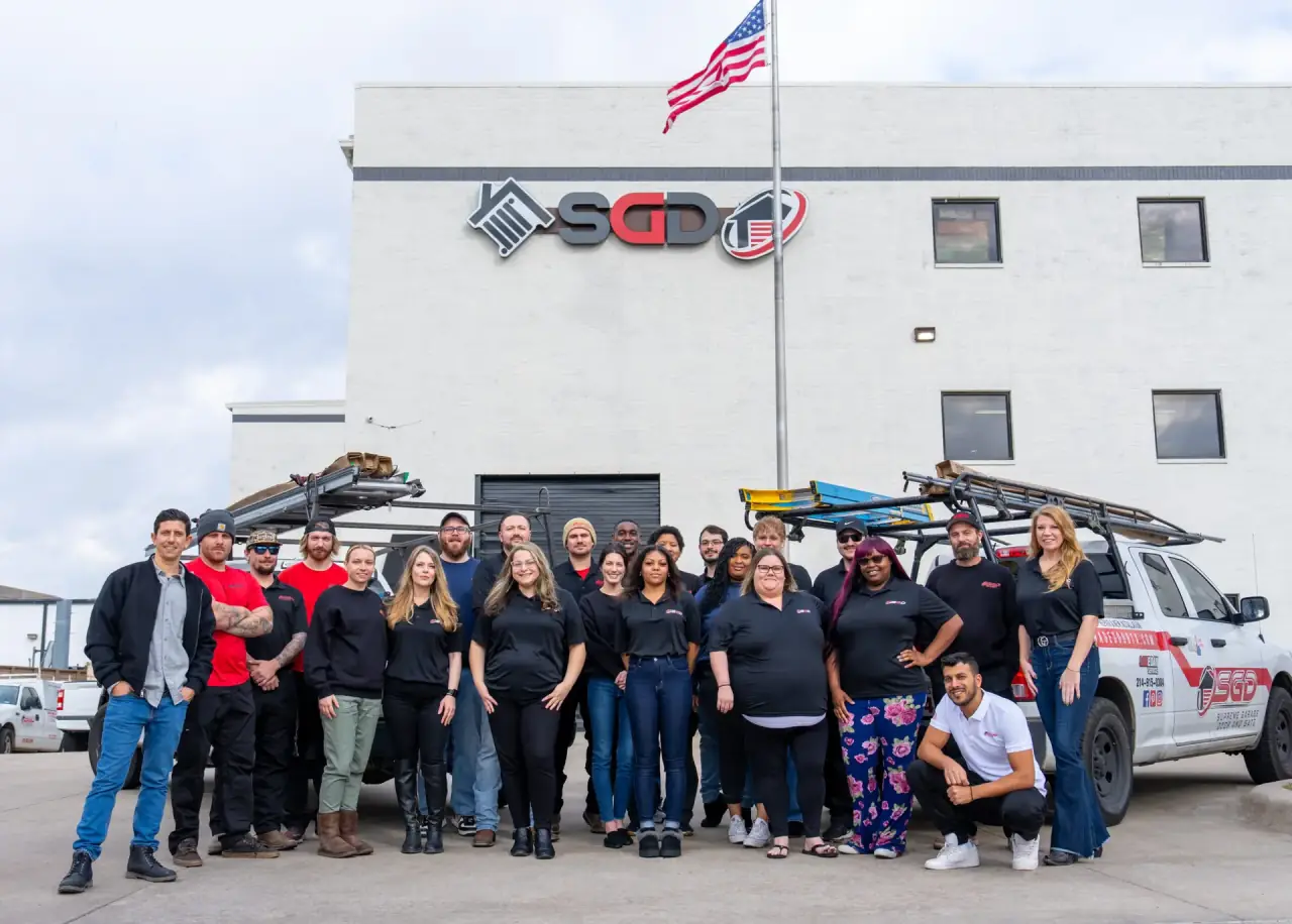 Supreme Garage Door team outside North Texas facility with service trucks